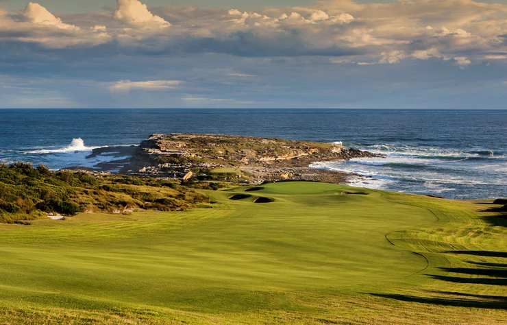 a golf course on a cliff overlooking the ocean .