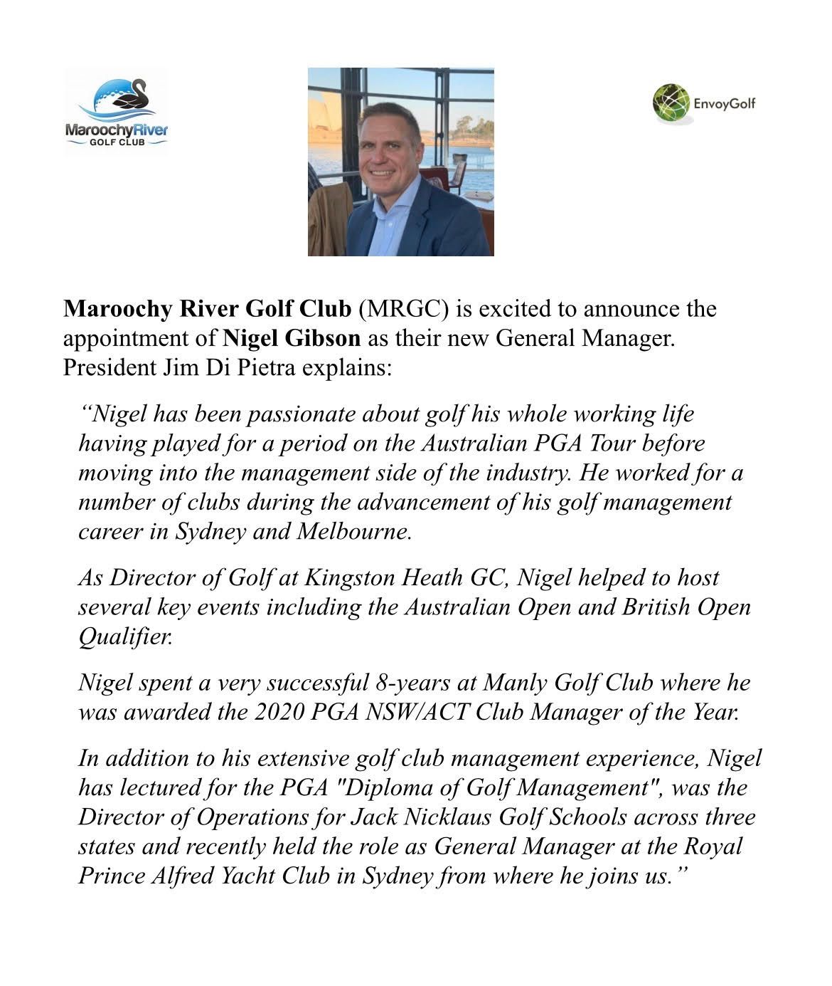 A man in a suit and tie is standing in front of a white background.